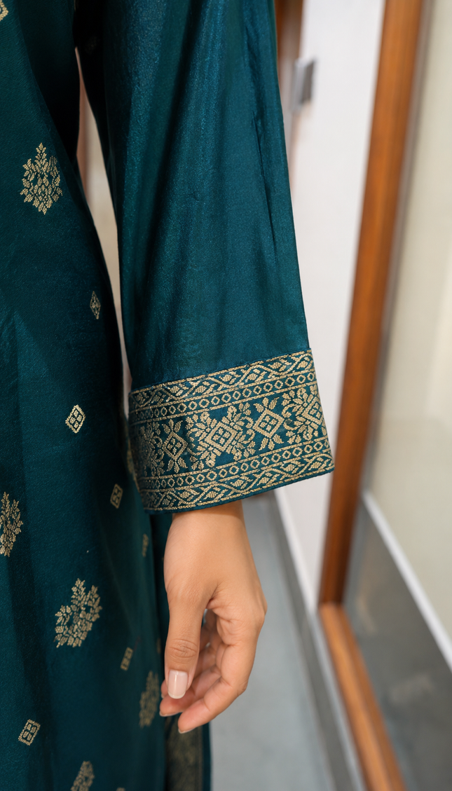 A teal embroidered suit crafted for effortless festive elegance.