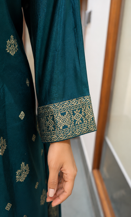 A teal embroidered suit crafted for effortless festive elegance.