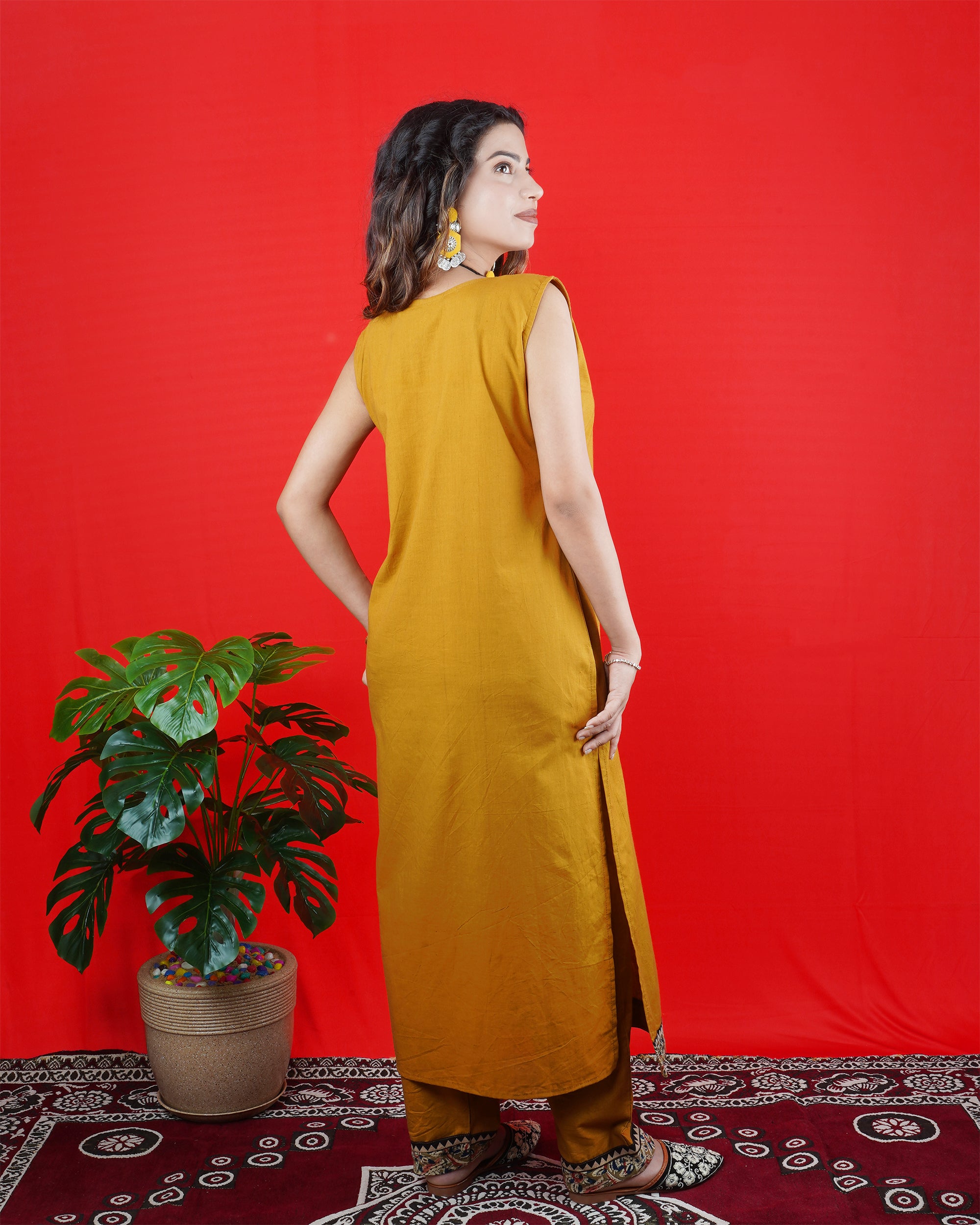 Mustard Yellow Sleeveless Kurta Set with Embroidered Neckline & Border Pants
