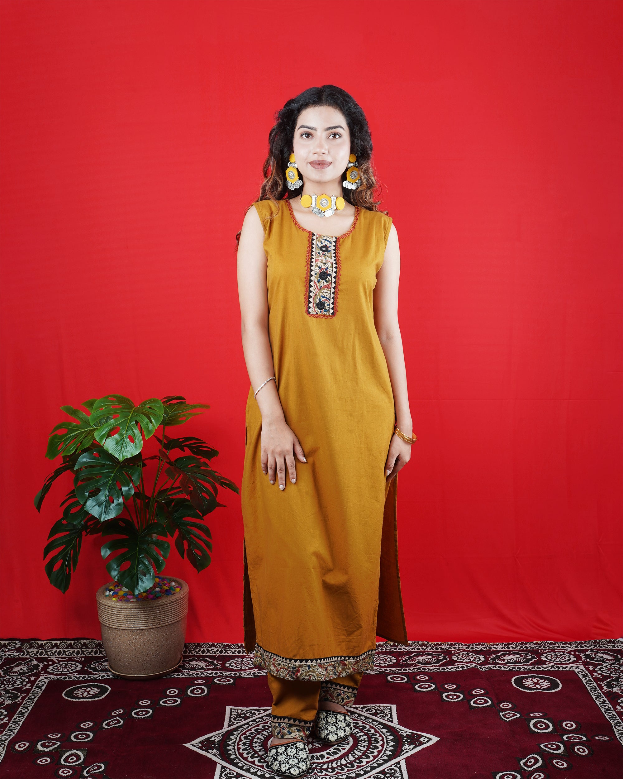Mustard Yellow Sleeveless Kurta Set with Embroidered Neckline & Border Pants