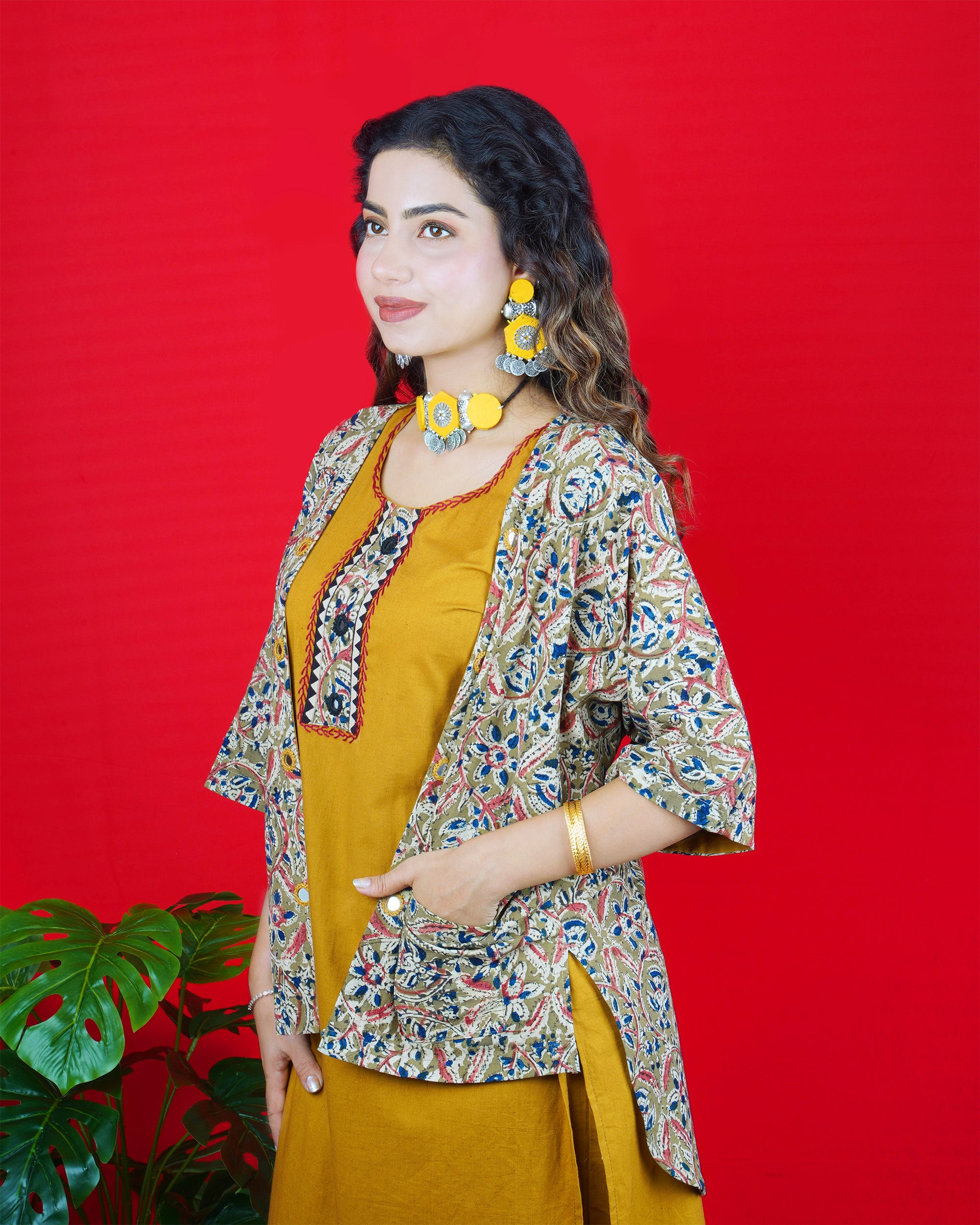Mustard Yellow Sleeveless Kurta Set with Embroidered Neckline & Border Pants